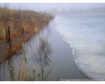 Фото природы. Расстающий лёд возле берега плотины. Февраль 2009 год.